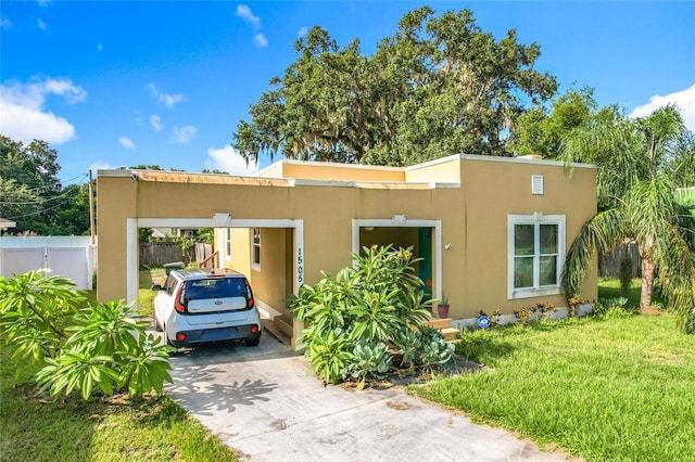1505 E Elm Rd, Lakeland, FL 33801 - view of front of house featuring stucco siding, concrete driveway, and an attached carport