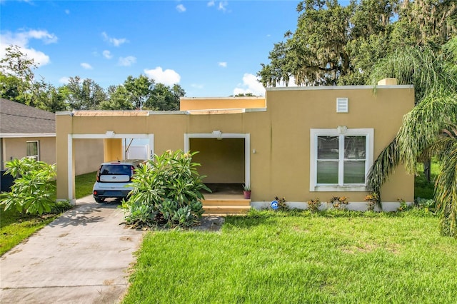 1505 E Elm Rd, Lakeland, FL 33801 - mediterranean / spanish home with a front lawn, stucco siding, and driveway