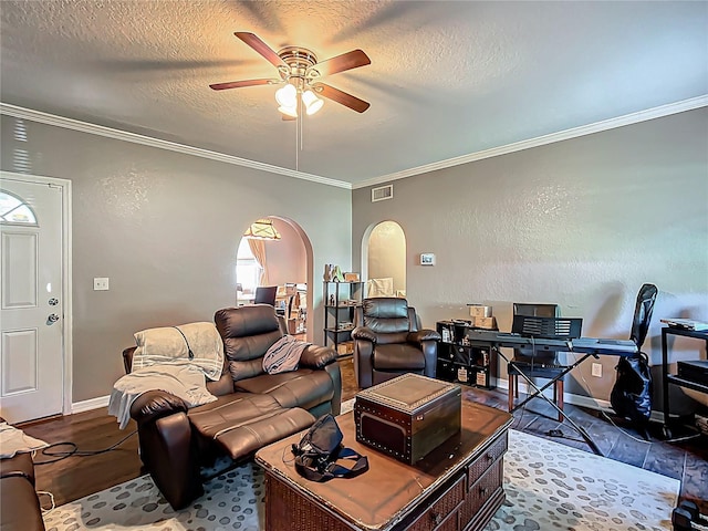 1505 E Elm Rd, Lakeland, FL 33801 - living area with arched walkways, ceiling fan, ornamental molding, a desk, and a textured ceiling
