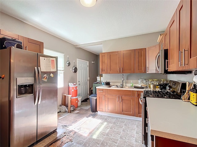 1505 E Elm Rd, Lakeland, FL 33801 - kitchen featuring appliances with stainless steel finishes, light countertops, and brown cabinets