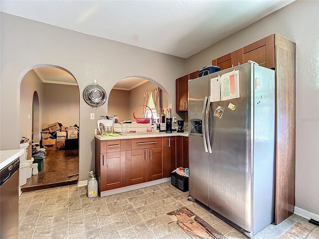 1505 E Elm Rd, Lakeland, FL 33801 - kitchen with stainless steel appliances, light countertops, ornamental molding, and arched walkways