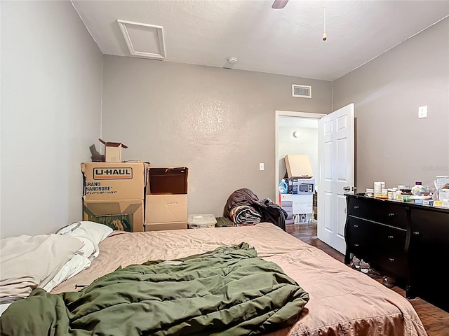 1505 E Elm Rd, Lakeland, FL 33801 - bedroom with dark wood-style floors, attic access, and a ceiling fan