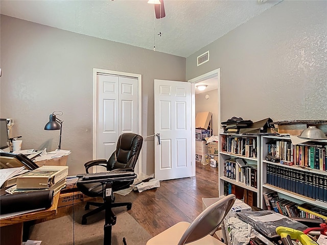 1505 E Elm Rd, Lakeland, FL 33801 - home office featuring a textured wall, wood-type flooring, ceiling fan, and a textured ceiling