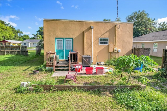 1505 E Elm Rd, Lakeland, FL 33801 - rear view of house featuring stucco siding