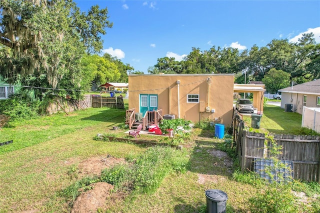 1505 E Elm Rd, Lakeland, FL 33801 - fenced backyard with a carport