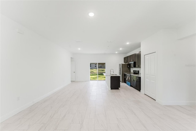 627 W Glenhaven Dr, Citrus Springs, FL 34434 - unfurnished living room with recessed lighting