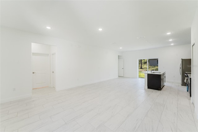 627 W Glenhaven Dr, Citrus Springs, FL 34434 - unfurnished living room featuring recessed lighting