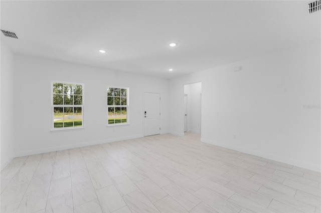 627 W Glenhaven Dr, Citrus Springs, FL 34434 - empty room with recessed lighting and baseboards