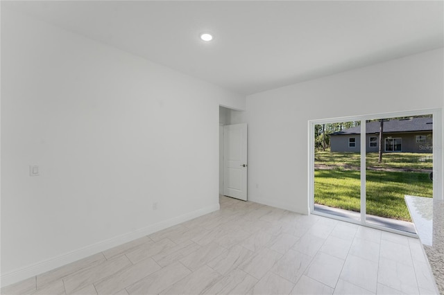 627 W Glenhaven Dr, Citrus Springs, FL 34434 - spare room featuring baseboards and recessed lighting