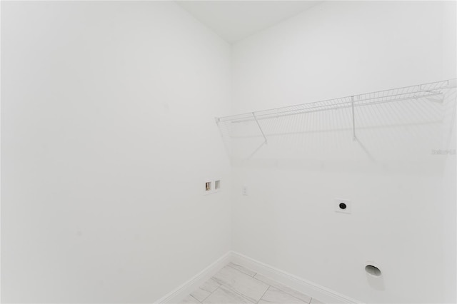 627 W Glenhaven Dr, Citrus Springs, FL 34434 - washroom with electric dryer hookup, hookup for a washing machine, and light marble finish floors