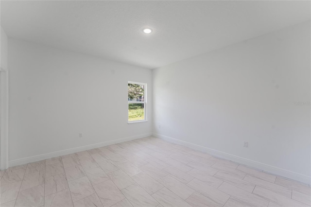627 W Glenhaven Dr, Citrus Springs, FL 34434 - spare room featuring recessed lighting and baseboards
