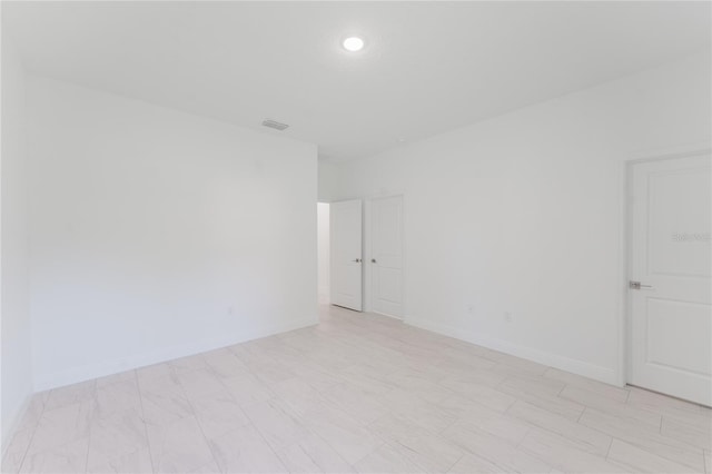 627 W Glenhaven Dr, Citrus Springs, FL 34434 - unfurnished room with baseboards and recessed lighting