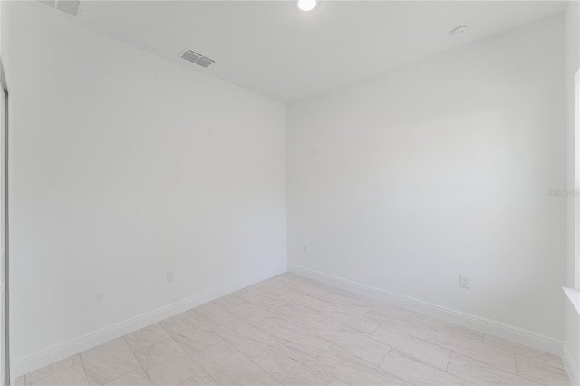 627 W Glenhaven Dr, Citrus Springs, FL 34434 - spare room with baseboards and recessed lighting