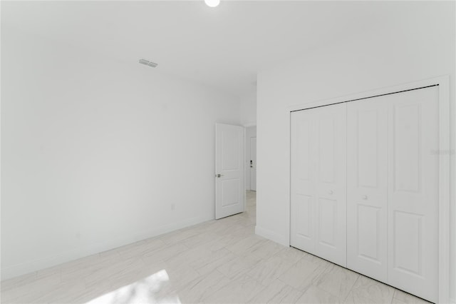 627 W Glenhaven Dr, Citrus Springs, FL 34434 - unfurnished bedroom with a closet and baseboards