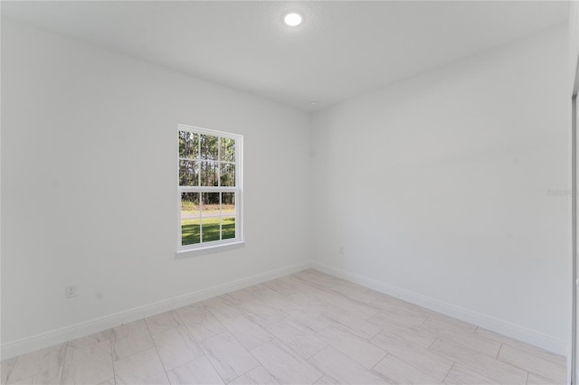 627 W Glenhaven Dr, Citrus Springs, FL 34434 - empty room with baseboards and recessed lighting
