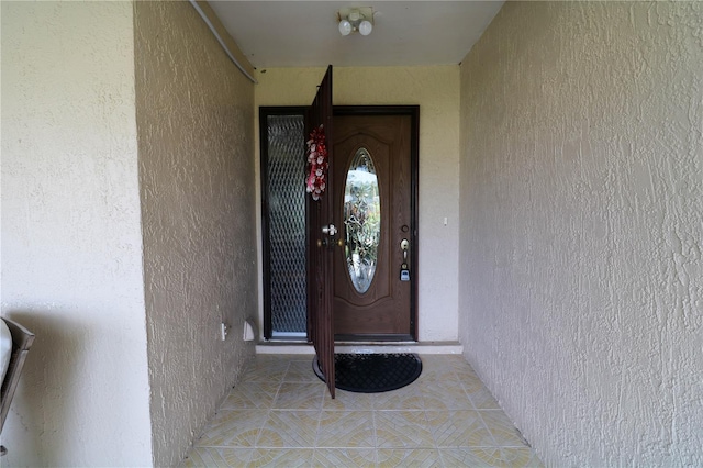 317 Cortez Ct, Kissimmee, FL 34758 - doorway to property with stucco siding