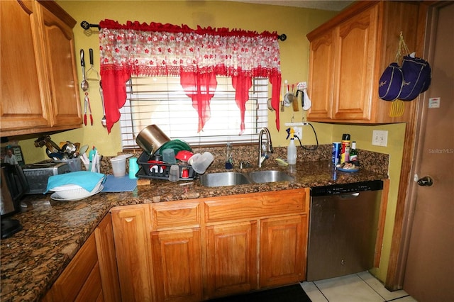 317 Cortez Ct, Kissimmee, FL 34758 - kitchen featuring dishwasher, brown cabinets, and dark stone countertops