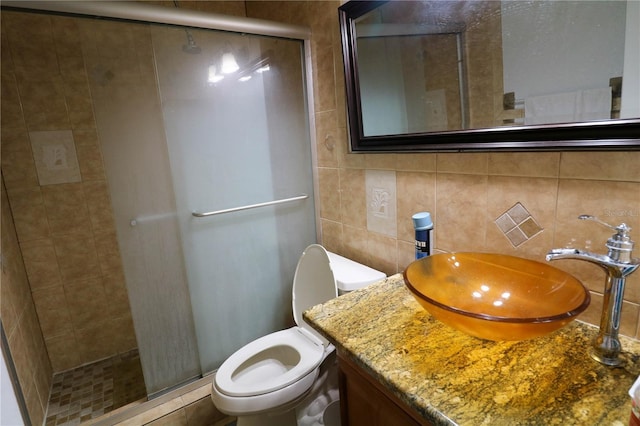 317 Cortez Ct, Kissimmee, FL 34758 - bathroom with a shower stall, vanity, backsplash, and tile walls