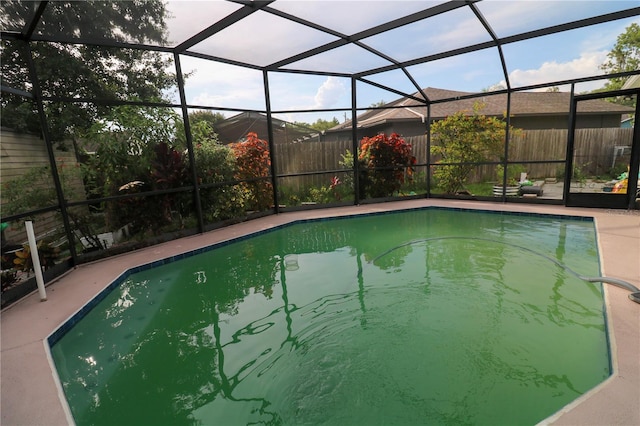 317 Cortez Ct, Kissimmee, FL 34758 - view of pool featuring glass enclosure and a patio