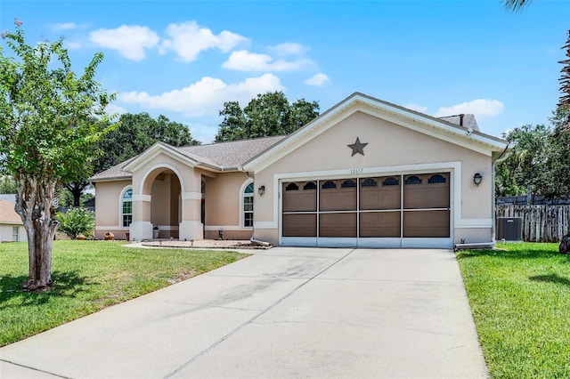 12617 Douglas Fir Ct, Clermont, FL 34711 - ranch-style home featuring stucco siding, an attached garage, and concrete driveway