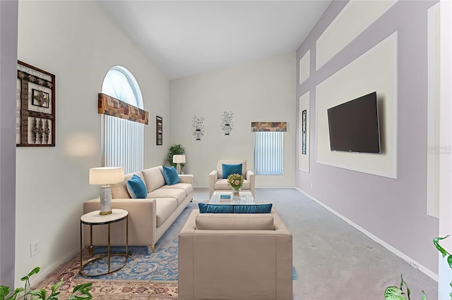 12617 Douglas Fir Ct, Clermont, FL 34711 - carpeted living room featuring vaulted ceiling and baseboards