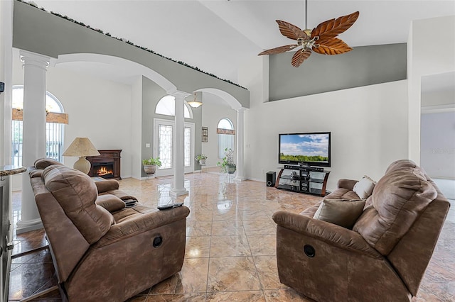 12617 Douglas Fir Ct, Clermont, FL 34711 - living room with decorative columns, arched walkways, plenty of natural light, high vaulted ceiling, and ceiling fan