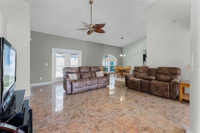 12617 Douglas Fir Ct, Clermont, FL 34711 - living room with marble tiled floors, high vaulted ceiling, ceiling fan, and a chandelier