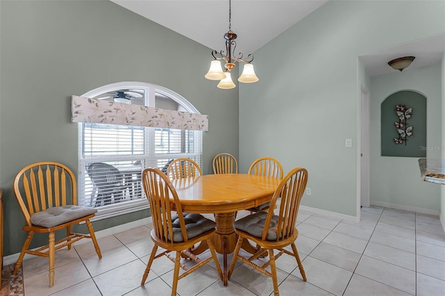 12617 Douglas Fir Ct, Clermont, FL 34711 - dining area featuring a chandelier, light tile patterned floors, and high vaulted ceiling