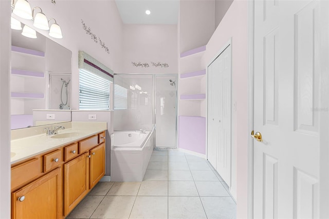 12617 Douglas Fir Ct, Clermont, FL 34711 - full bath featuring a shower stall, tile patterned flooring, a garden tub, and double vanity
