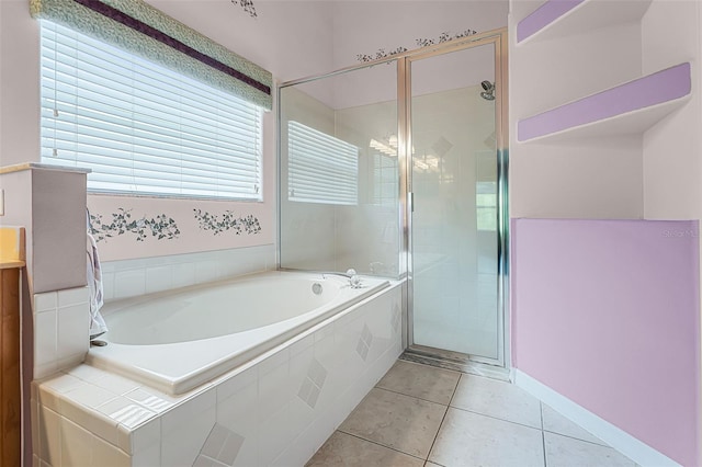 12617 Douglas Fir Ct, Clermont, FL 34711 - full bathroom with a bath, a stall shower, and tile patterned flooring