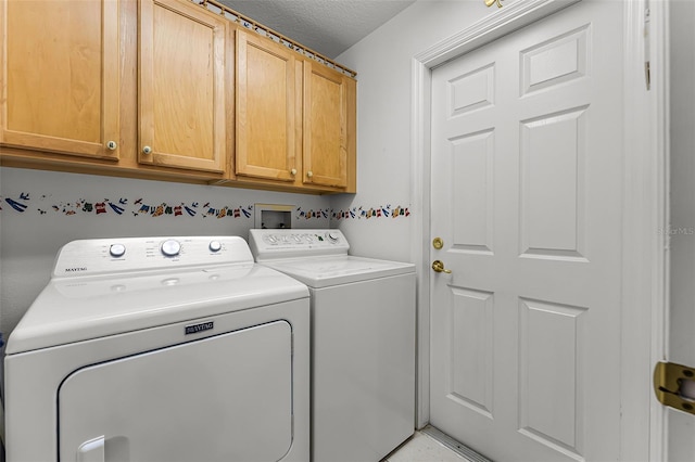 12617 Douglas Fir Ct, Clermont, FL 34711 - laundry room with washing machine and dryer, cabinet space, and a textured ceiling