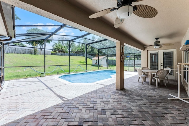 12617 Douglas Fir Ct, Clermont, FL 34711 - swimming pool with ceiling fan, a patio, glass enclosure, and outdoor dining area