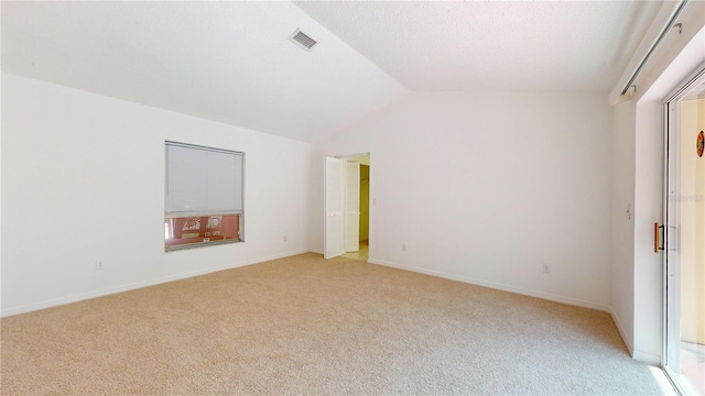 5045 Bermuda Cir Unit 12, Orlando, FL 32808 - empty room featuring light colored carpet and lofted ceiling