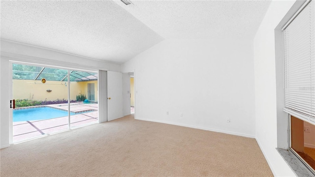 5045 Bermuda Cir Unit 12, Orlando, FL 32808 - empty room with carpet flooring, a textured ceiling, and lofted ceiling