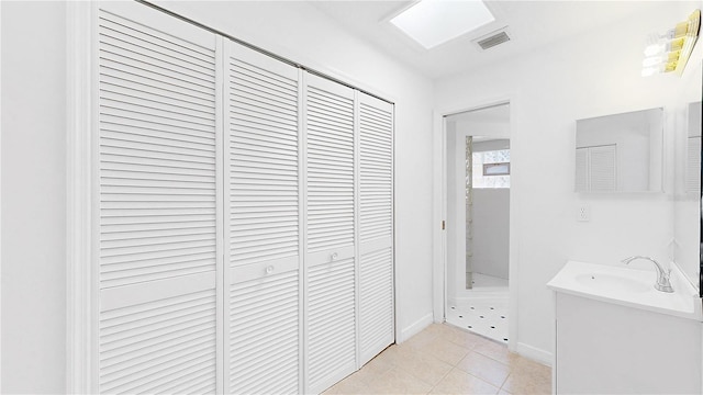 5045 Bermuda Cir Unit 12, Orlando, FL 32808 - hallway with a sink and light tile patterned floors