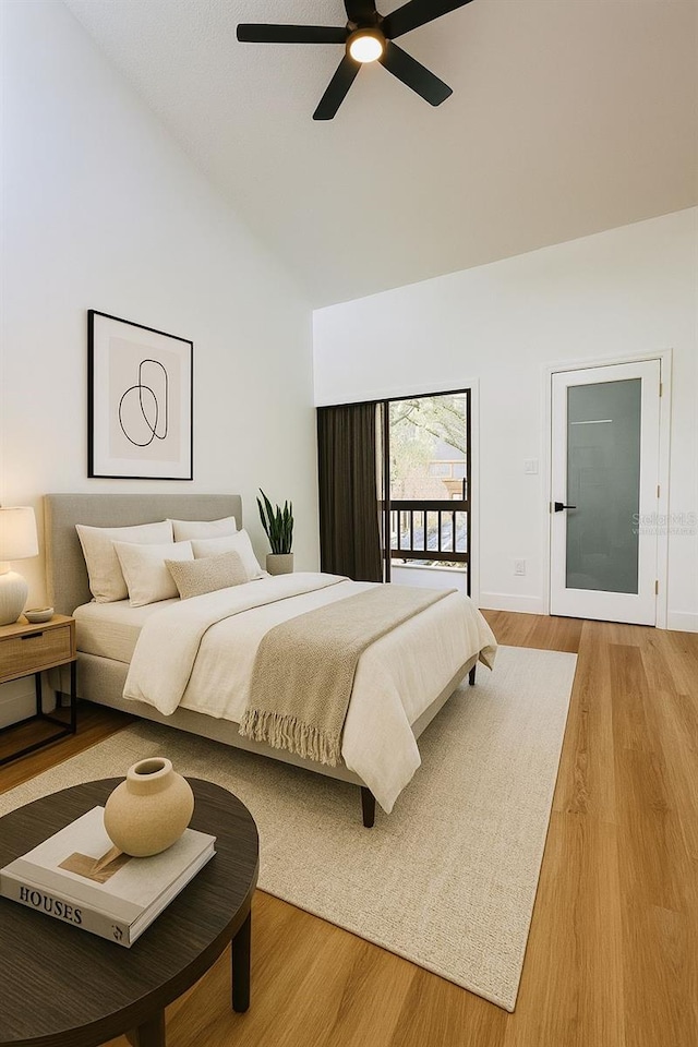 1050 E Michigan St Unit 1050B, Orlando, FL 32806 - bedroom with wood finished floors, high vaulted ceiling, and a ceiling fan