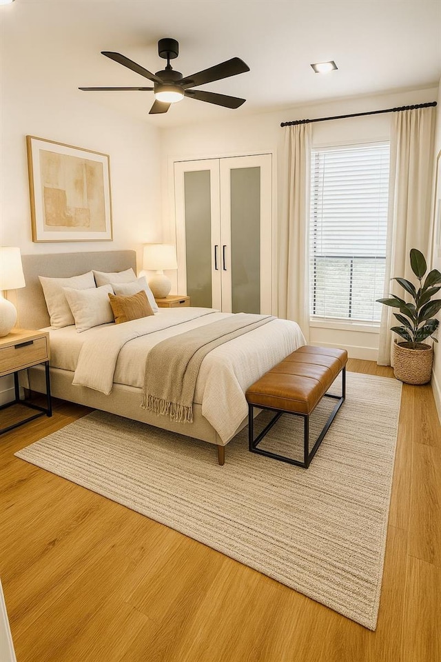 1050 E Michigan St Unit 1050B, Orlando, FL 32806 - bedroom featuring wood finished floors, ceiling fan, and a closet