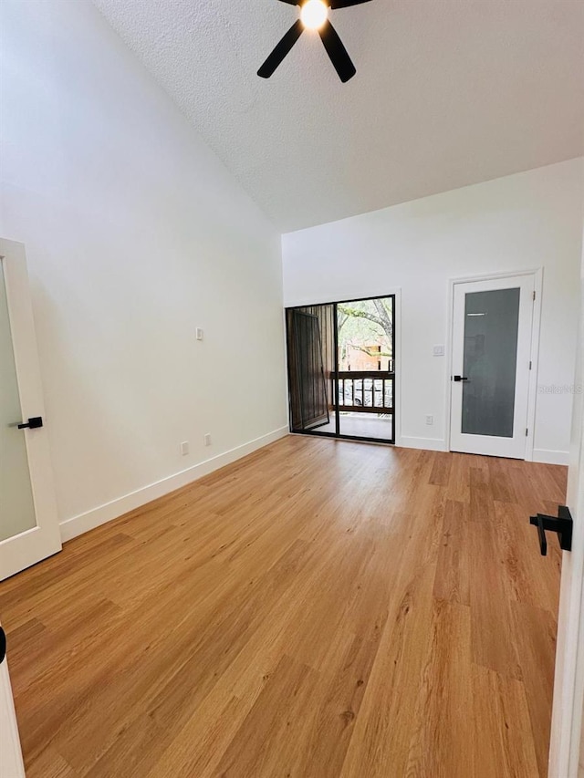 1050 E Michigan St Unit 1050B, Orlando, FL 32806 - unfurnished room with a ceiling fan, light wood-type flooring, a textured ceiling, and high vaulted ceiling