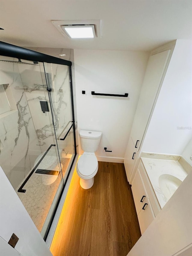 1050 E Michigan St Unit 1050B, Orlando, FL 32806 - full bathroom featuring a marble finish shower, vanity, and wood finished floors