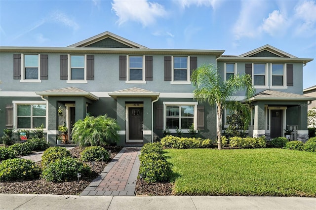 13298 Pontoon Rd, Winter Garden, FL 34787 - view of front facade featuring stucco siding and a front lawn