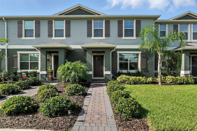 13298 Pontoon Rd, Winter Garden, FL 34787 - view of front of home featuring stucco siding and a front yard