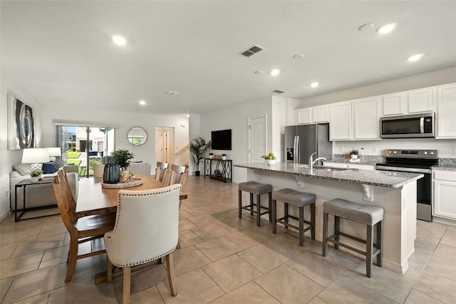 13298 Pontoon Rd, Winter Garden, FL 34787 - dining room with recessed lighting and light tile patterned floors