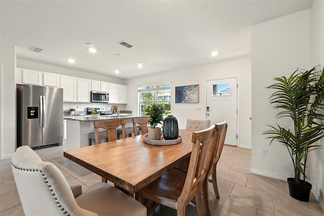 13298 Pontoon Rd, Winter Garden, FL 34787 - dining room featuring light tile patterned floors and recessed lighting