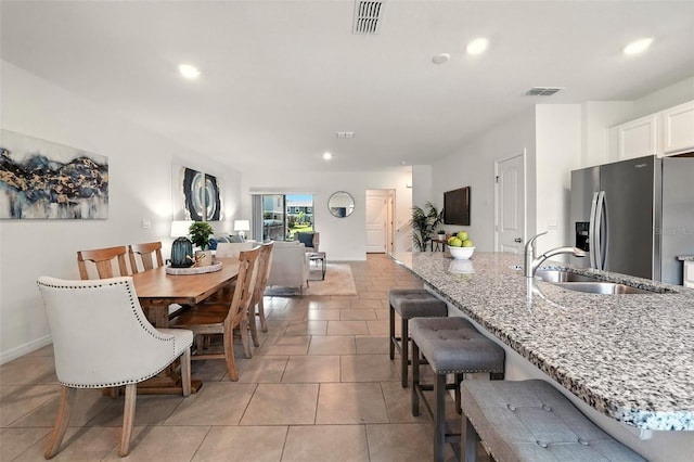 13298 Pontoon Rd, Winter Garden, FL 34787 - dining space with recessed lighting and light tile patterned floors