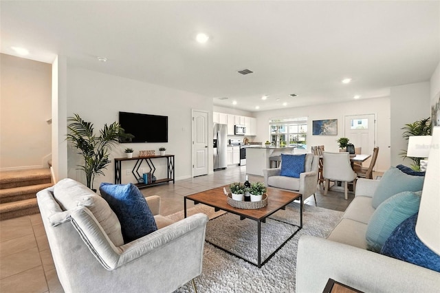13298 Pontoon Rd, Winter Garden, FL 34787 - living area featuring light tile patterned flooring, stairway, and recessed lighting