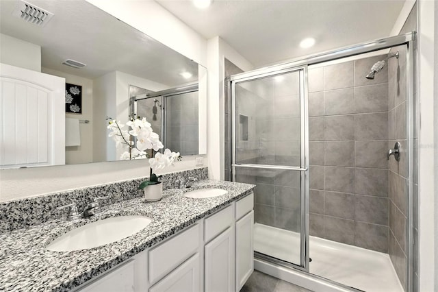 13298 Pontoon Rd, Winter Garden, FL 34787 - full bathroom with a shower stall, double vanity, and recessed lighting