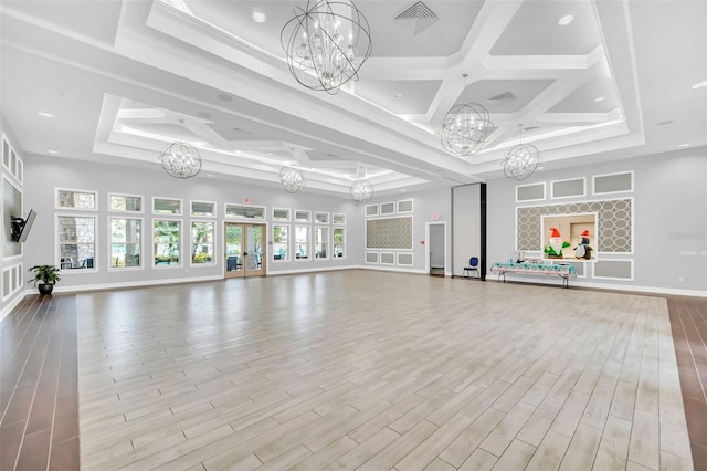 13298 Pontoon Rd, Winter Garden, FL 34787 - exercise area with a chandelier, coffered ceiling, wood finished floors, and a tray ceiling