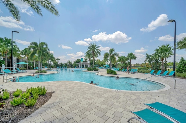 13298 Pontoon Rd, Winter Garden, FL 34787 - community pool featuring a patio area