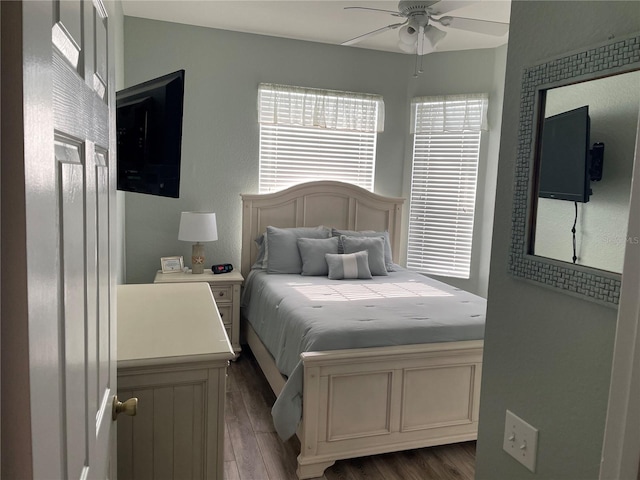 2817 Almaton Loop Unit 403, Kissimmee, FL 34747 - bedroom featuring dark wood-style floors and ceiling fan