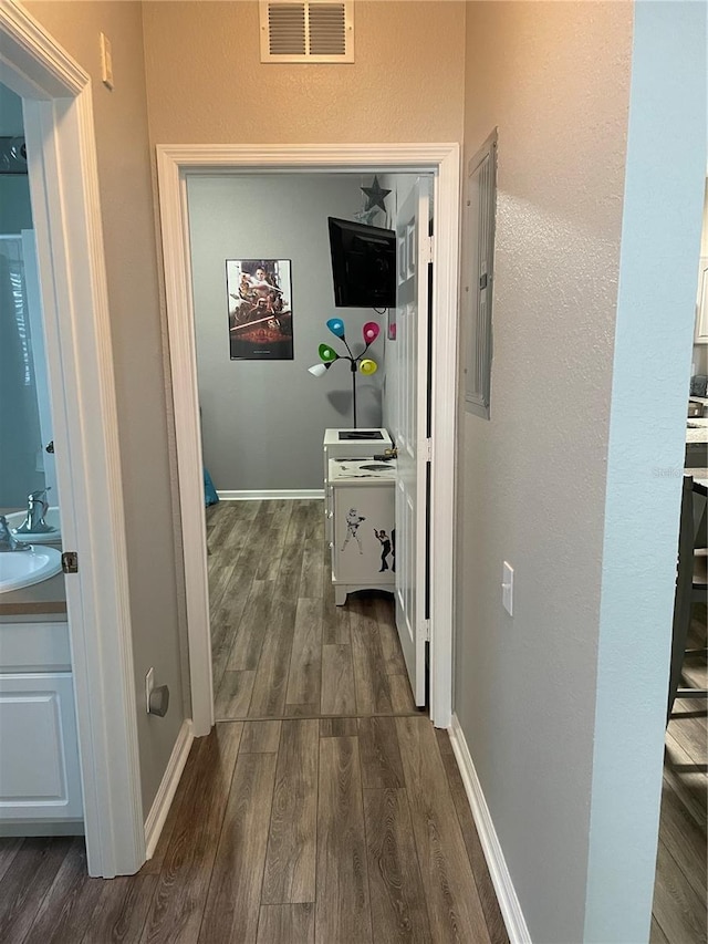 2817 Almaton Loop Unit 403, Kissimmee, FL 34747 - corridor featuring dark wood-style floors and electric panel